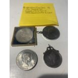 FOUR COINS - AN 1889 FLORIN IN STAMPED SILVER MOUNT AND THREE COMMEMORATIVE CROWNS