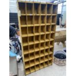 A METAL FORTY EIGHT SECTION PIGEON HOLE STORAGE UNIT