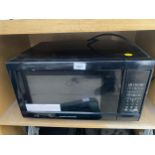 A BLACK MORPHY RICHARDS MICROWAVE OVEN