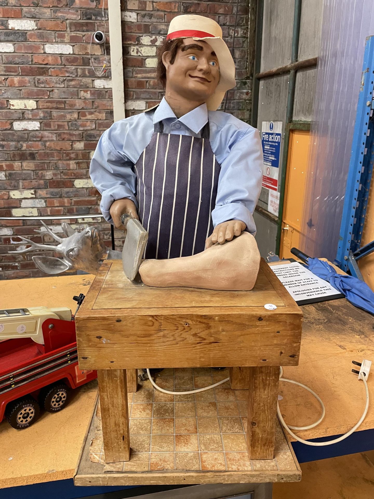AN AUTOMATED FIGURE OF A BUTCHER