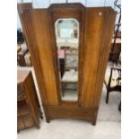 AN EARLY 20TH CENTURY OAK MIRROR DOOR WARDROBE