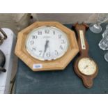 A WOODEN FRAMED CLOCK AND A BEROMETER