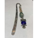 A SILVER HOOK WITH A BLUE STONE OWL AND A FURTHER GREEN BEAD