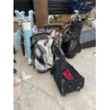 AN ASSORTMENT OF GOLF ITEMS TO INCLUDE CLUBS, GOLF BAGS, DRIVERS ETC