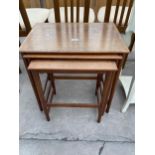 A RETRO TEAK NEST OF THREE TABLES