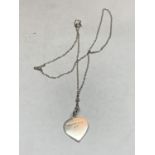 A SILVER NECKLACE WITH A HEART PENDANT MARKED TIFFANY AND CO 925