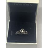 A SILVER PANDORA RING WITH A HEART AND STONE DESIGN IN A PRESENTATION BOX
