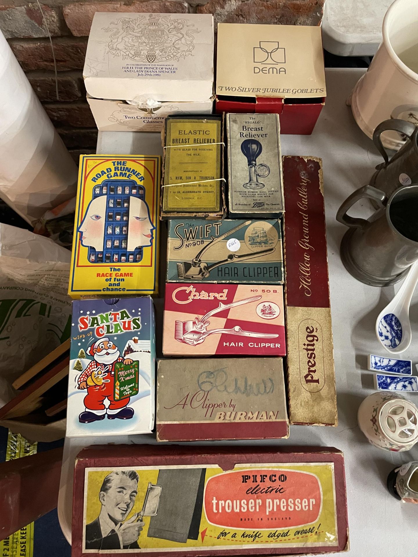 VARIOUS BOXED VINTAGE ITEMS TO INCLUDE HAIR CLIPPERS, TROUSER PRESS, BREAST RELIEVERS ETC