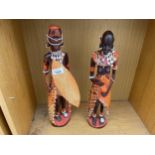 A PAIR OF TREEN CARVED TRIBAL FIGURES