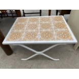 A METAL FRAMED COFFEE TABLE WITH TILED TOP - 26" X 30"