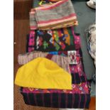 A QUANTITY OF TEXTILES IN PINKS, BLACK, YELLOW, BLUES AND GREY