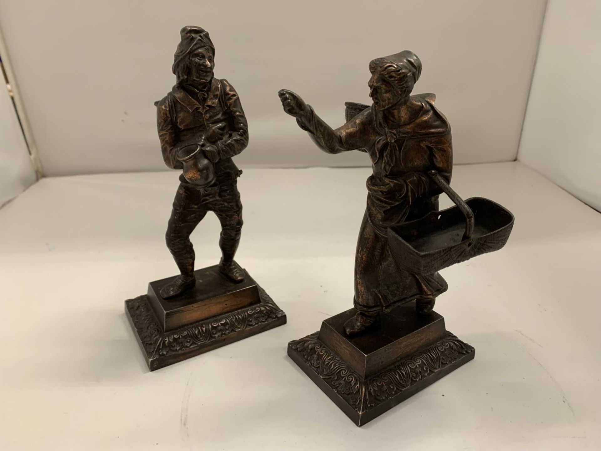 TWO BRONZE FIGURINES OF FRENCH GRAPE PICKERS