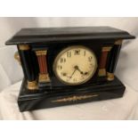 AN AMERICAN WOODEN MANTLE CLOCK WITH COLUMNS