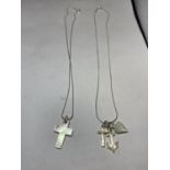 TWO SILVER NECKLACES WITH PENDANTS TO INCLUDE A MOTHER OF PEARL CROSS ON ONE AND A CROSS, ANCHOR AND