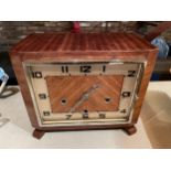 A WOODEN CASED ART DECO MANTLE CLOCK WITH THE PENDULUM