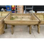 A LARGE WOODEN TROUGH PLANTER (120CM X 84CM X 79CM)