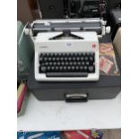 A CASED OLYMPIA TYPE WRITER