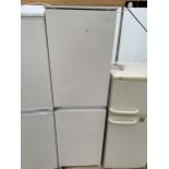 A WHITE WHIRLPOOL INTERGRATED FRIDGE FREEZER