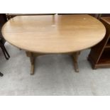 AN ERCOL STYLE DROP-LEAF DINING TABLE