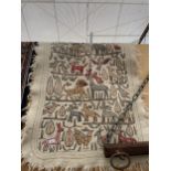 A DECORATIVE RUG DEPICTING ABSTRACT ANIMALS