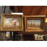 TWO SMALL GILT FRAMED PICTURES OF SHIPS ON A BEACH