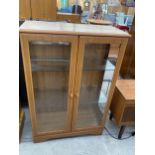 A MODERN TWO DOOR GLAZED DISPLAY CABINET