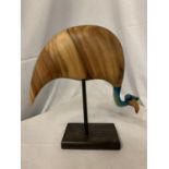 A WOODEN BIRD FIGURE