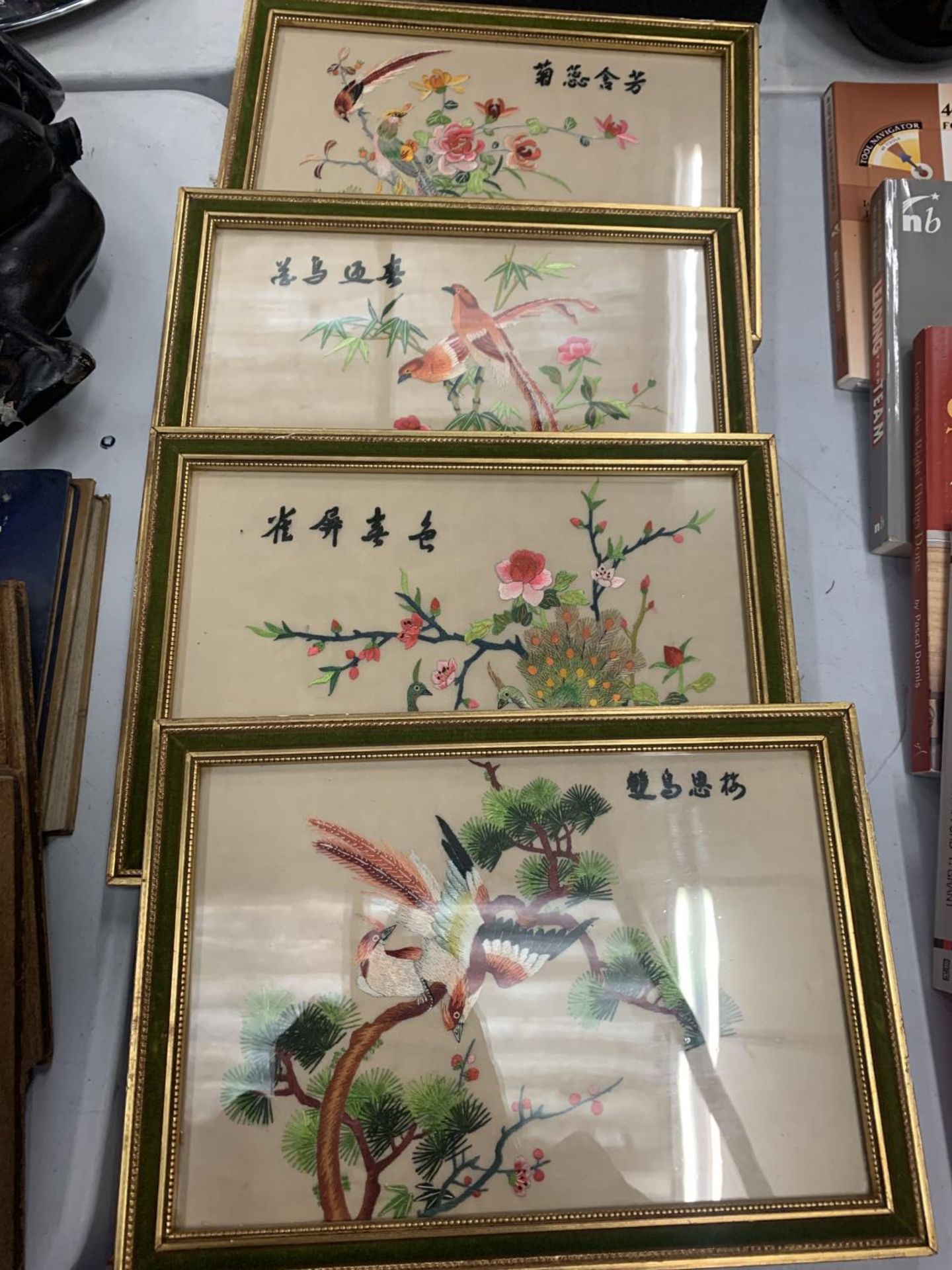 FOUR FRAMED SILK EMBROIDERED ORIENTAL STYLE PICTURES OF BIRDS