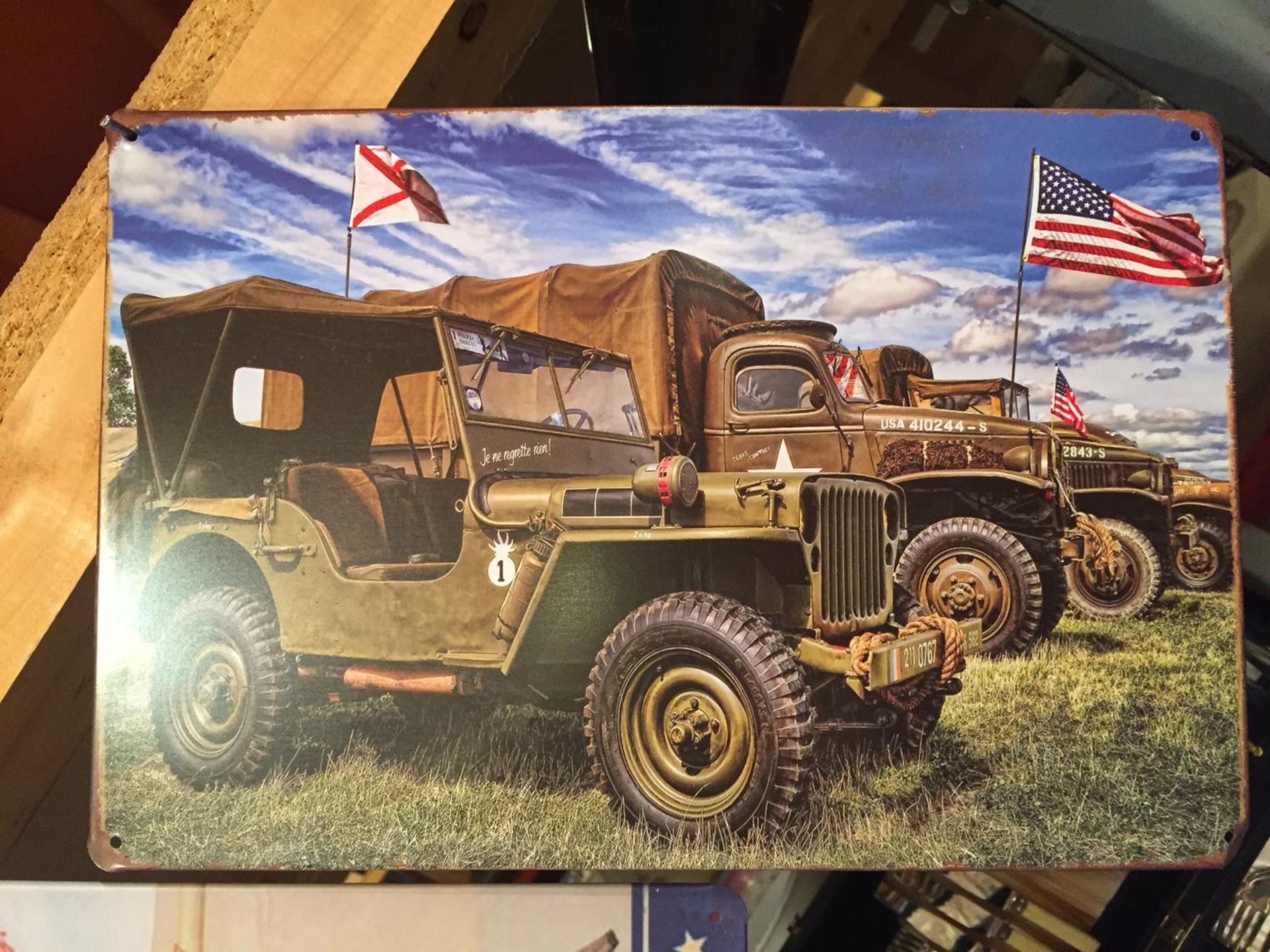 A TIN AMERICAN MILITARY VEHICLES SIGN