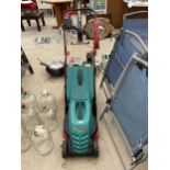 AN ELECTRIC BOSCH ROTAK 32 R LAWN MOWER WITH GRASS BOX IN WORKING ORDER BUT NO WARRANTY GIVEN
