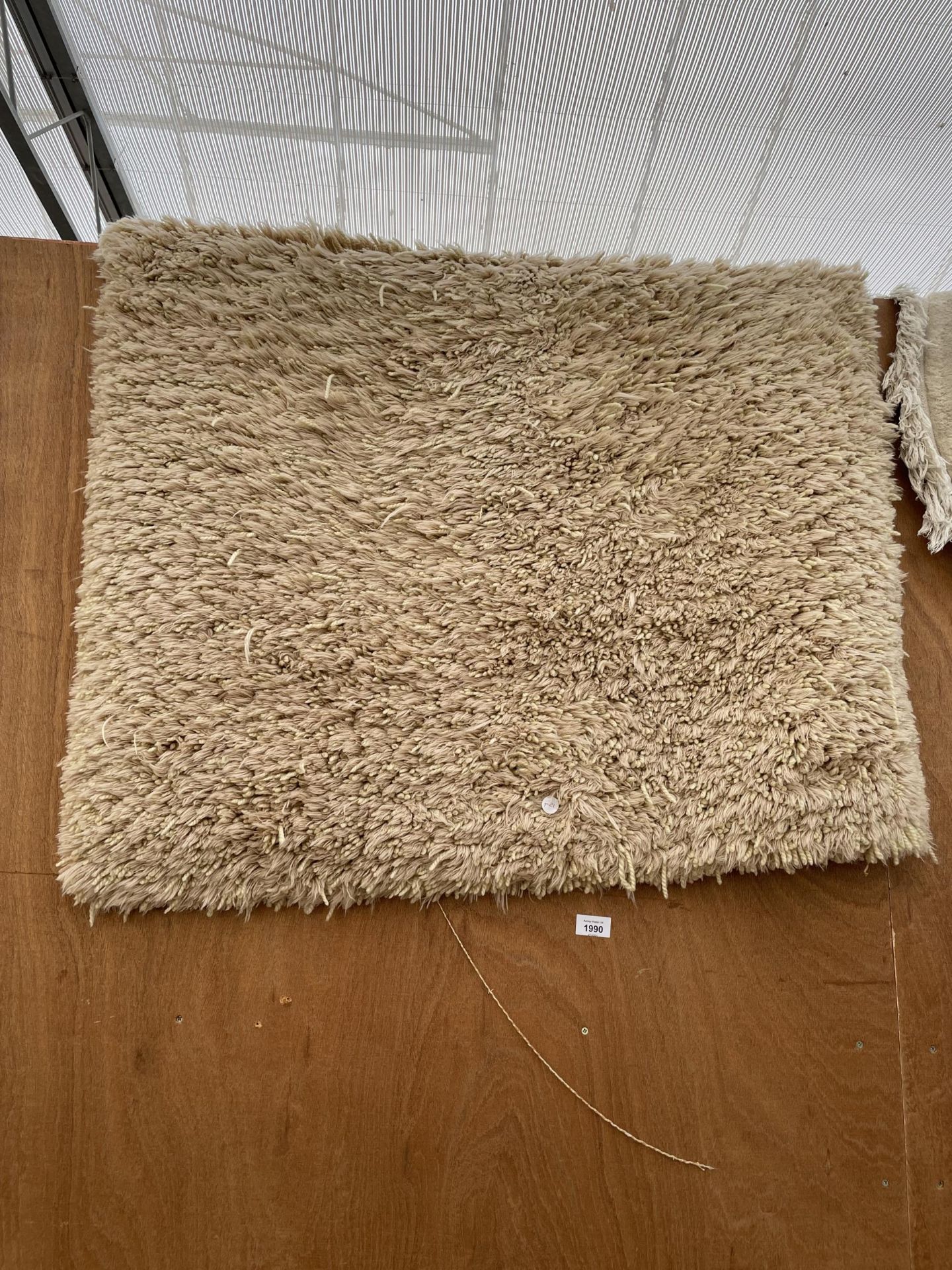 A MODERN CREAM RUG