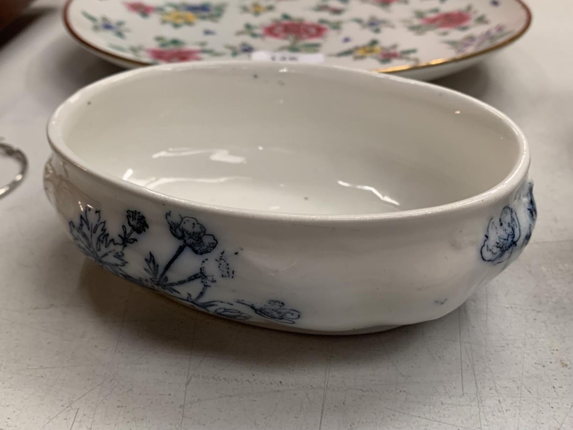 A PRETTY BLUE AND WHITE OVAL SHAPED DISH STAMPED DOULTON BURSLEM