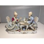 A VICTORIAN DRESDEN DOUBLE FIGURE OF A LADY AND GENT PLAYING CARDS