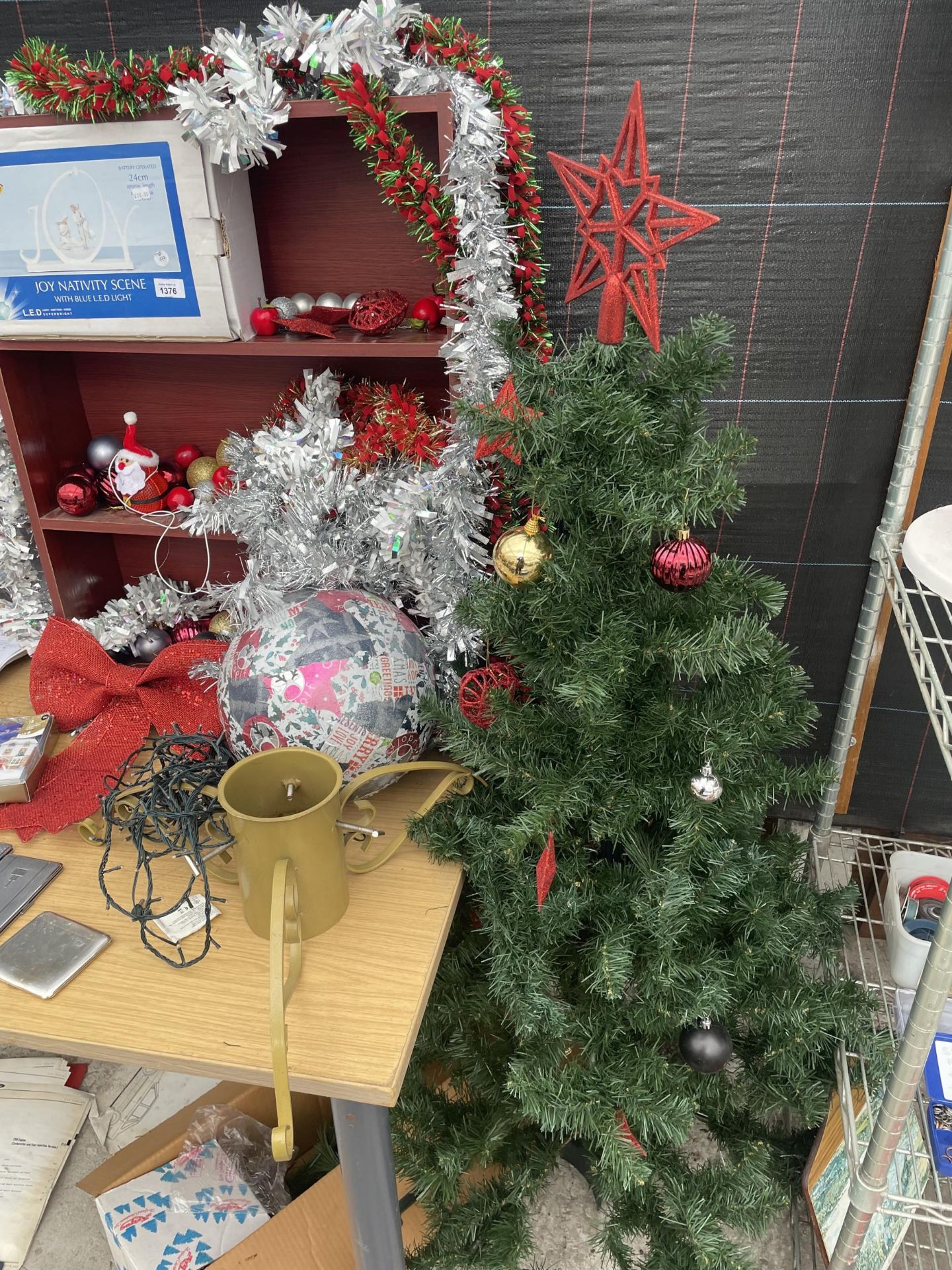 AN ASSORTMENT OF CHRISTMAS ITEMS TO INCLUDE AN ARTIFICIAL TREE, A CHRISTMAS TREE STAND AND A LIGHT