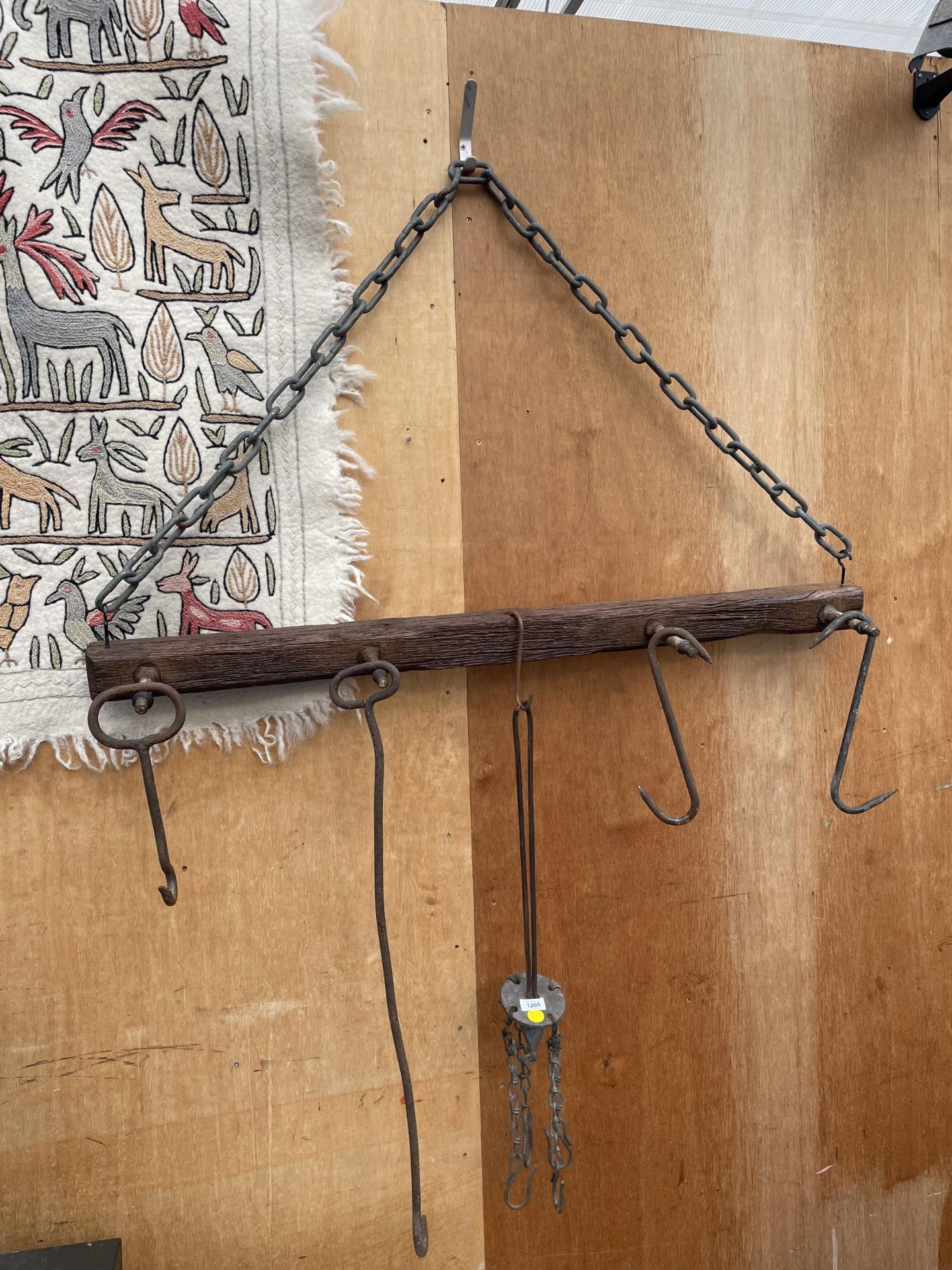 A VINTAGE HANGING FRAME WITH VARIOUS BLACKSMITHS TOOLS