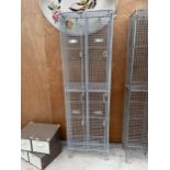 A GALVANISED FOUR SECTION LOCKER UNIT