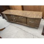 A 1970'S WALNUT EFFECT SIDEBOARD ENCLOSING COCKTAIL CABINET, TWO FURTHER CUPBOARDS AND THREE DRAWERS