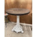 A 19TH CENTUARY COALBROOKDALE CAST IRON TABLE BASE WITH WOODEN TOP ON SCROLL FEET AND THE COLUMN