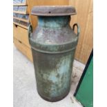 A VINTAGE CAST IRON MILK CHURN WITH LID BEARING THE STAMP NEWHALL DAIRIES LIMITED