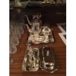 A SILVER PLATED COFFEE SET ON A TRAY TO INCLUDE COFFEE POT, CREAM JUG, SUGAR NIPS, BUTTER DISH,
