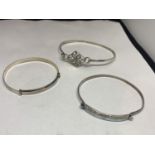 THREE VARIOUS SILVER BANGLES