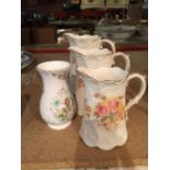 A TRIO OF GRADUATED JUGS MARKED JERSEY K & CO LATE MAYERS TO THE BASE