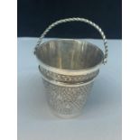 A WHITE METAL POSSIBLY SILVER ORNATE MINIATURE BUCKET