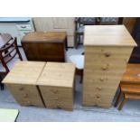 A PAIR OF PINE EFFECT BEDSIDE CHESTS AND A MATCHING TALL CHEST OF SIX DRAWERS