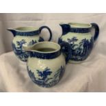 A SET OF THREE ' VICTORIA WARE ' BLUE AND WHITE GRADUATED JUGS