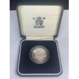 A QUEEN ELIZABETH II SILVER PROOF £2 COIN IN A PRESENTATION BOX