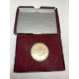 A BOXED UNITED STATES MINT AMERICAN SILVER HALF DOLLAR TO CELEBRATE 250TH ANNIVERSARY OF THE BIRTH