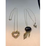 TWO MARKED 925 SILVER NECKLACES WITH PENDANTS TO INCLUDE A BLACK STONE DROP AND COLOURED STONE HEART