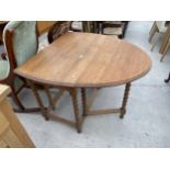 AN EARLY 20TH CENTURY OVAL OAK GATE LEG DINING TABLE ON BARLEY TWIST SUPPORTS