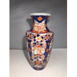 AN IMARI ORIENTAL VASE DECORATED WITH FLOWERS IN BLUE, RED AND GREEN. HEIGHT 30CM